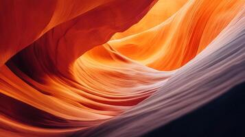 Abstract rock formation showing layers of red, orange, and purple rock creating a swirling, textured pattern in a canyon. photo