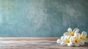Delicate white blossoms cascade on weathered wood, blending nature's simplicity with rustic charm against a muted blue backdrop. photo