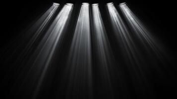 Rays of light pierce through a deep, dark space, creating an ethereal illumination that highlights the void with beams of shining clarity. photo