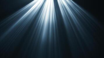 Rays of light cascade from above, piercing the darkness with ethereal illumination, creating a serene and atmospheric ambiance. photo