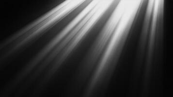 Dramatic illumination in grayscale photography, highlighting dynamic light beams slicing through a dark, moody atmosphere, creating visual contrast. photo