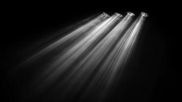 Striking monochrome image with shafts of bright light piercing through the darkness, creating a dramatic and ethereal atmosphere. photo