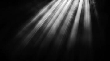 Rays of light pierce the darkness, illuminating a mysterious space. A visual study in contrast, texture, and abstract composition. photo