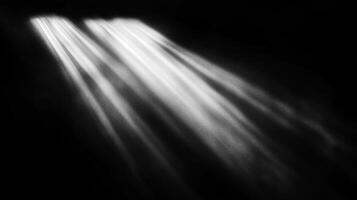 Striking black and white image featuring beams of light cutting through darkness, creating a dramatic and contrasting effect, very abstract. photo
