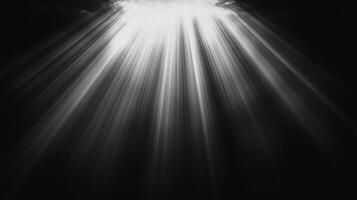 Dramatic lighting with bright rays shining through darkness. Light illuminates the space with beams piercing downward creating a powerful effect. photo