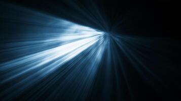 A striking image featuring a burst of light, emanating from a central point against a stark, dark backdrop. The light is a cool blue. photo