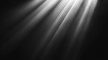 Light streams from the top right corner of the frame, creating a captivating contrast against the darkness below, creating a dramatic effect. photo