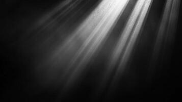 A monochrome image with beams of light shining through the darkness, creating a dramatic and atmospheric scene. Ethereal glow. photo