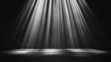 Dramatic lighting in a dark room, creating a striking visual effect. A contrast of bright light and shadow defines the scene. photo