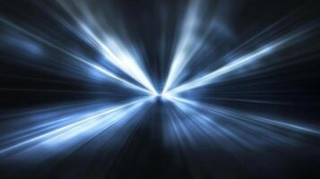 Abstract image with a central point emanating blue and white light rays against a dark background, creating a sense of speed and motion. photo