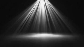 Illuminated stage with bright light rays shining down from above, creating a dramatic and captivating atmosphere in a darkened room. photo