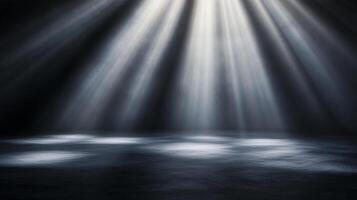 Rays of light stream into a dimly lit space, illuminating a textured floor with a magical, ethereal glow. Spotlight effect is dramatic. photo