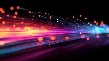 Abstract image of neon lights forming a colourful pattern moving at speed from left to right on a black background, with bokeh dots. photo