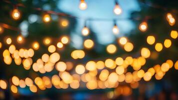 String lights create a warm, inviting ambiance against a blurred backdrop, perfect for celebrations and gatherings. Festive and bright. photo