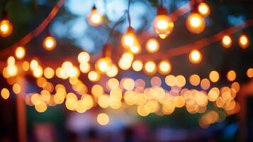 Festive light bulbs create a warm and inviting atmosphere, blurring into bokeh orbs on a string against an evening sky. Dreamy illumination. photo
