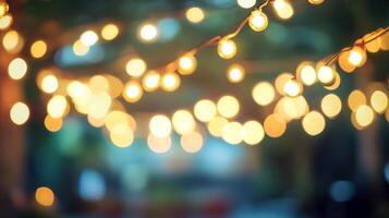 Festive illuminated string lights create a warm ambiance. Blurred background adds depth. Perfect for celebrations and cozy atmospheres. photo
