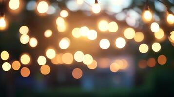 Ambient string lights glow warmly, casting blurred light across an outdoor space, creating a magical, inviting atmosphere for gatherings. photo