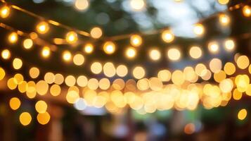Blurred festive string lights glow softly, creating a warm, inviting ambiance for any celebration or outdoor gathering space. photo