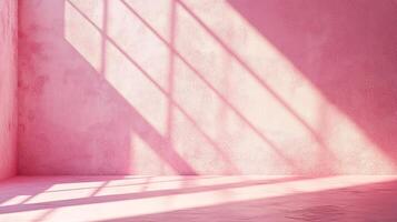 A textured pink wall bathed in light, with shadows casting geometric patterns across the surface. A simple yet visually striking scene. photo