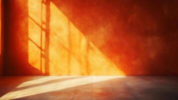 Sunlight creates patterns on a textured orange wall, adding depth and warmth to the empty room. The light and shadow enhance the space. photo