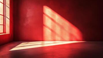 A red room with light streaming in from a window. The light creates patterns on the wall and floor, making it a visually interesting space. photo