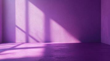 A minimalistic purple room is illuminated by sunlight creating geometric shapes and abstract forms. A calming and contemporary look. photo