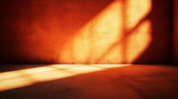 A dimly lit orange-toned room, bathed in sunlight filtering through a window, casts a pattern on the wall, creating a warm and inviting ambiance. photo