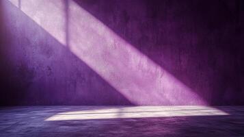 Sunlight streams across a purple wall, creating a dramatic contrast of light and shadow in an empty room. A minimalist scene. photo