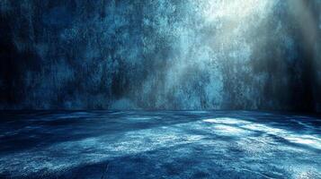 Abstract blue grunge wall and floor illuminated by a beam of light creating a stark and mysterious atmosphere. Perfect for creative projects. photo