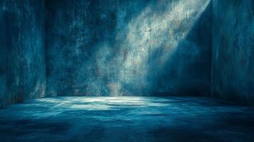 Abstract room with textured blue walls and floor, illuminated by a shaft of light, creating a moody and atmospheric space. photo