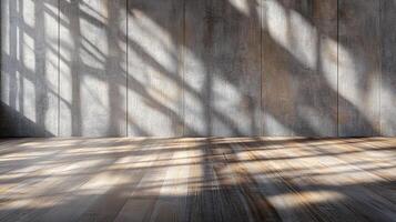 Sunlight streams through unseen windows, casting patterns across a wood floor and a textured concrete wall, creating a serene and minimalist scene. photo