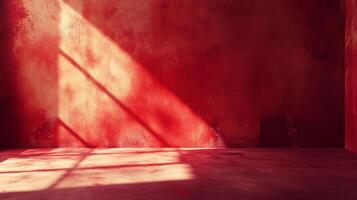 A single sharp ray of light casts shadows across a textured deep red interior room. The room is empty, but the sun shines brightly. photo