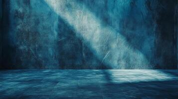 A serene and mysterious scene unfolds, with a beam of light gently illuminating a textured wall in a monochromatic blue setting, creating depth. photo