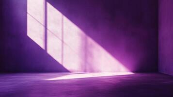 Purple room with light beam. Light coming from a window creates strong contrast on the wall, making an interesting geometric pattern. photo