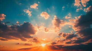 Vibrant sunset scene with golden sun rays piercing through clouds, creating a stunning display of color in the vast sky. photo