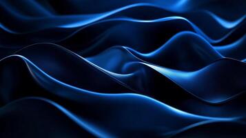 Abstract, dark blue waves are illuminated on the edges, creating a fluid and dynamic texture that invites the viewer to dive into the deep blue. photo