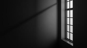 Monochromatic minimalist shot of light streaming through a window, casting soft shadows across a dark grey wall. Stark and contemplative. photo
