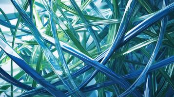 Abstract view of entangled translucent tubes of blue and green creating depth and dimension in an interesting artistic composition. photo