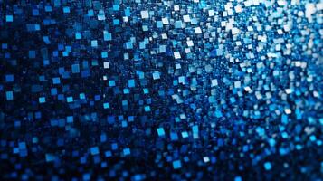 Abstract arrangement of many tiny squares. The squares are shades of blue and are densely packed to make an overall abstract shape. photo
