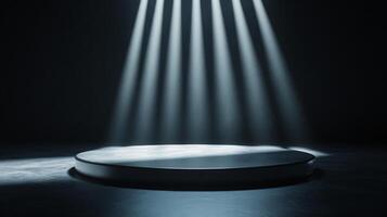 Round podium illuminated by spotlights creates a dramatic scene in a dark room, ready for product placement or presentation photo
