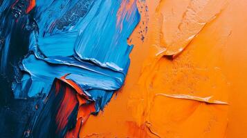 Abstract painting featuring textured strokes of vivid blue and orange, creating a dynamic visual interplay of color and form on a canvas. photo