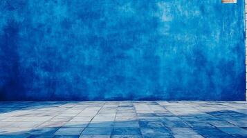 A striking cobalt painted wall meets a tiled floor in a compelling visual interplay, embodying simplicity with a hint of aged texture. photo