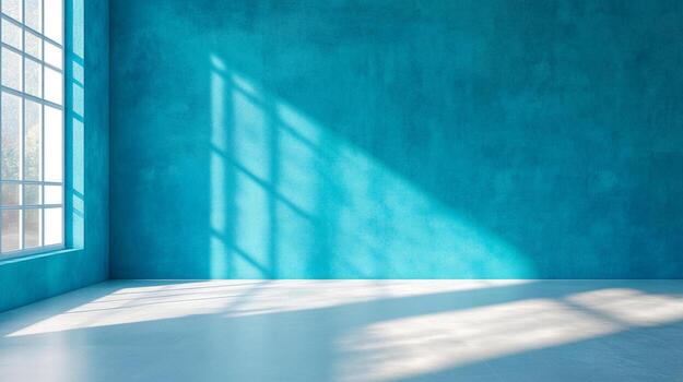 Sunlight streams through a window onto a textured teal wall, creating shadow patterns on the white floor, emphasizing light and color. photo