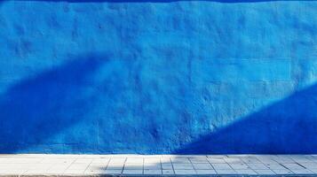 A vibrant blue wall creates a captivating contrast with the textured surface, inviting the viewer into a world of color and dimension. photo