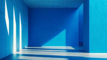 Minimalist blue room interior with geometric light patterns creating stark contrasts, showcasing modern architecture and design elements. photo