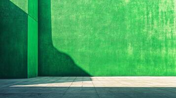 A stark, minimalist composition featuring a green textured wall, contrasted by shadows and a grey tiled floor, creating a geometric abstraction. photo