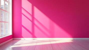 Illuminated interior space with pink walls, light wood floors, and bright sunlight streaming through a window. The space has a modern feel. photo