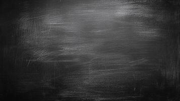 A dark, textured surface with subtle white marks creates a moody and artistic backdrop. Ideal for adding depth and character to designs. photo