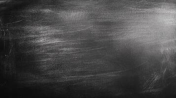 A textured black surface catches the light, creating a dynamic interplay of shadows and highlights, bringing depth to a simple background. photo