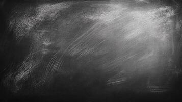 A dark, textured surface. The texture appears to be chalk or a similar material smeared across a solid base, creating an abstract look. photo